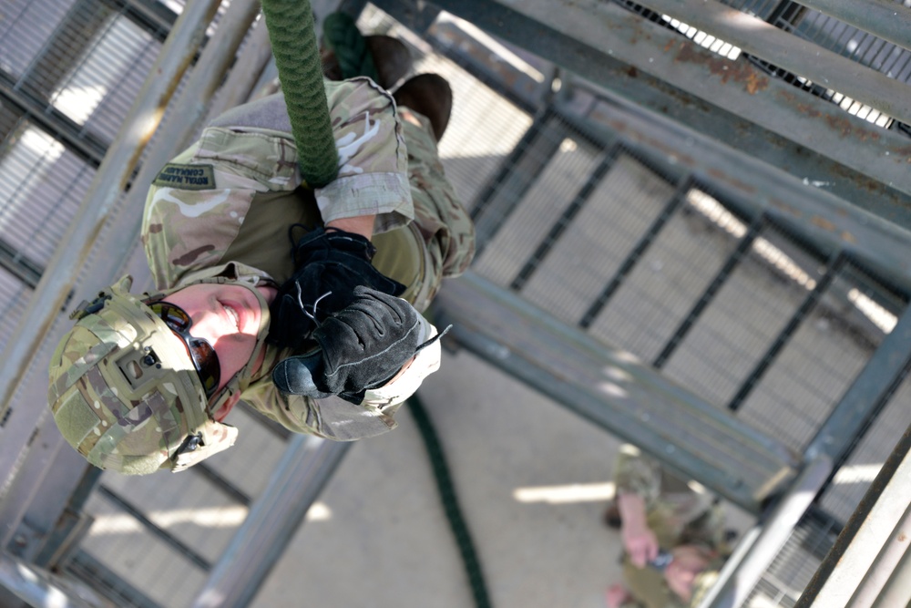 British Royal Marine commandos fast rope with SPMAGTF-CR-AF Marines