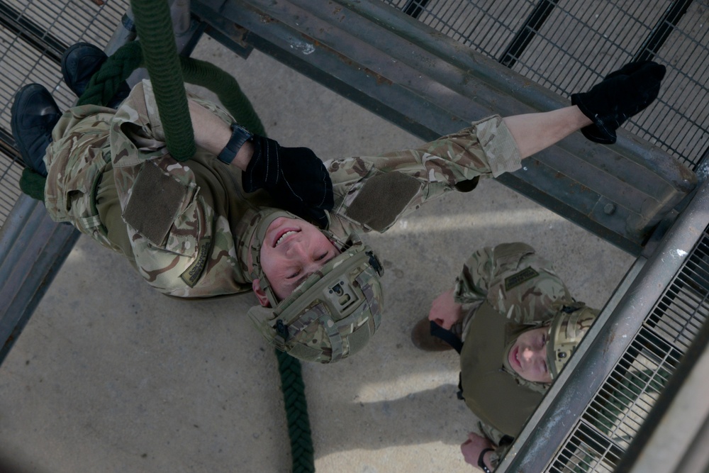 British Royal Marine commandos fast rope with SPMAGTF-CR-AF Marines