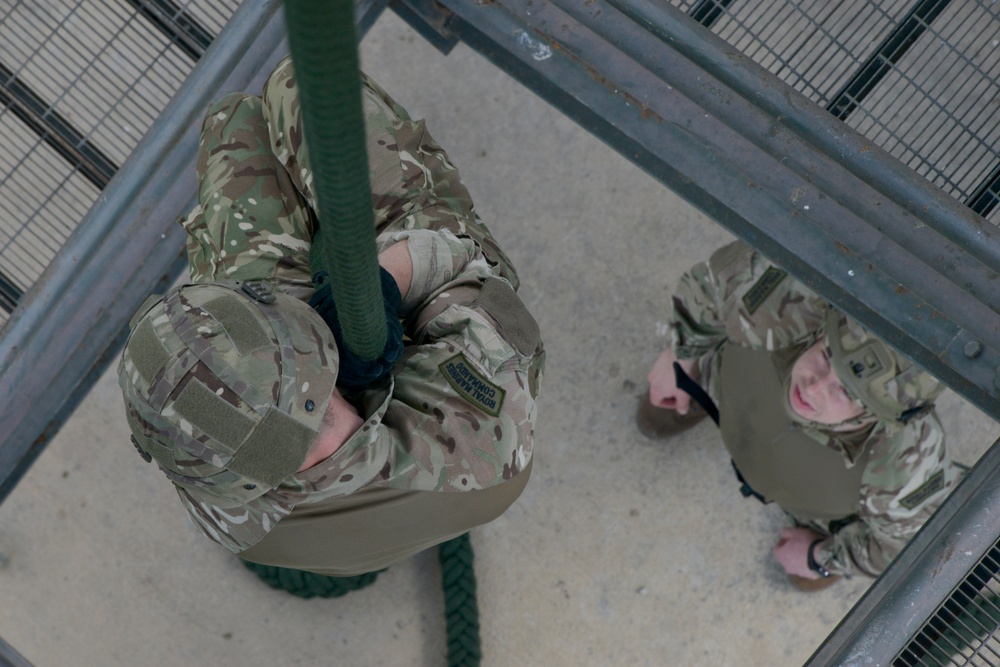 British Royal Marine commandos fast rope with SPMAGTF-CR-AF Marines