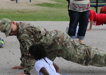 Heavy Truck soldiers educate, entertain children at adopted school