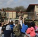 Heavy Truck soldiers educate, entertain children at adopted school