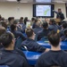 Sailors aboard USNS Mercy attend a port brief