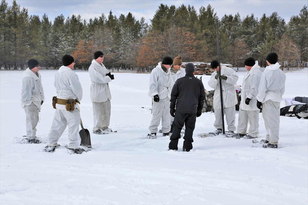 Cold-Weather Operations Course Class 18-06 students build Arctic tents during training at Fort McCoy