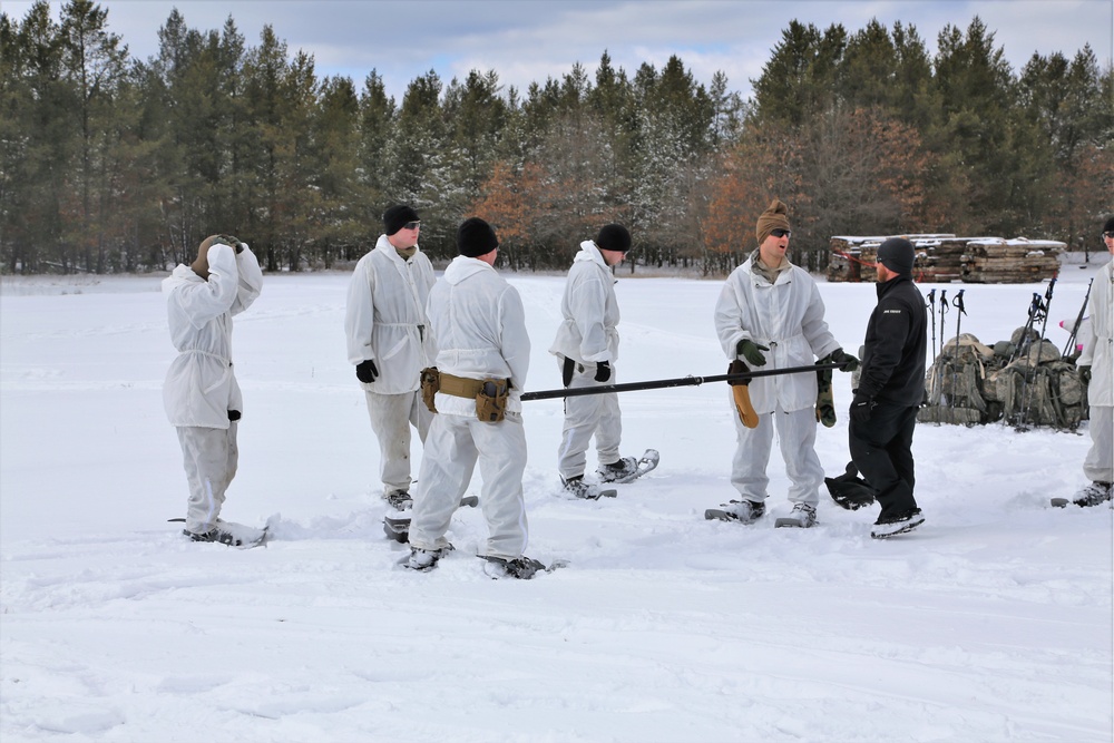 Cold-Weather Operations Course Class 18-06 students build Arctic tents during training at Fort McCoy