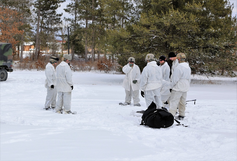 Cold-Weather Operations Course Class 18-06 students build Arctic tents during training at Fort McCoy