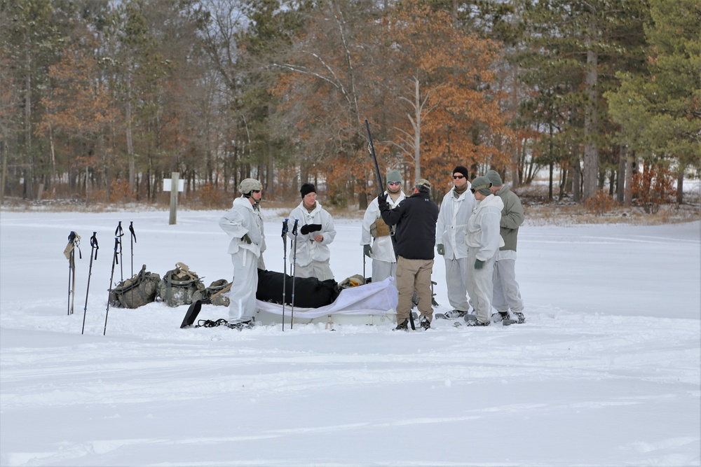 Cold-Weather Operations Course Class 18-06 students build Arctic tents during training at Fort McCoy