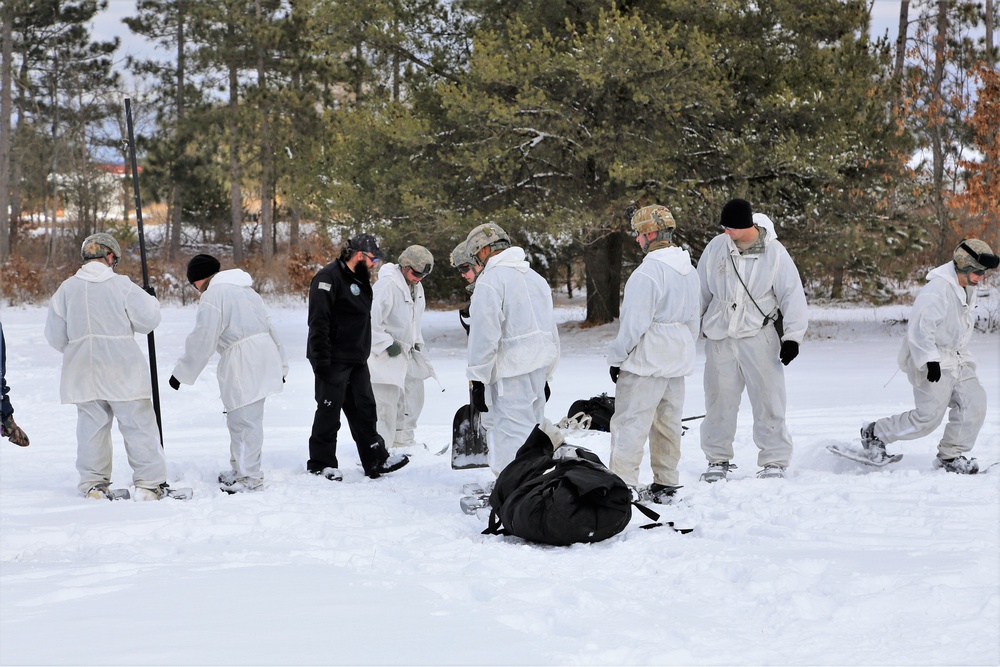 Cold-Weather Operations Course Class 18-06 students build Arctic tents during training at Fort McCoy