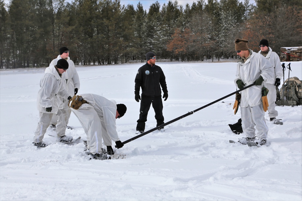 Cold-Weather Operations Course Class 18-06 students build Arctic tents during training at Fort McCoy