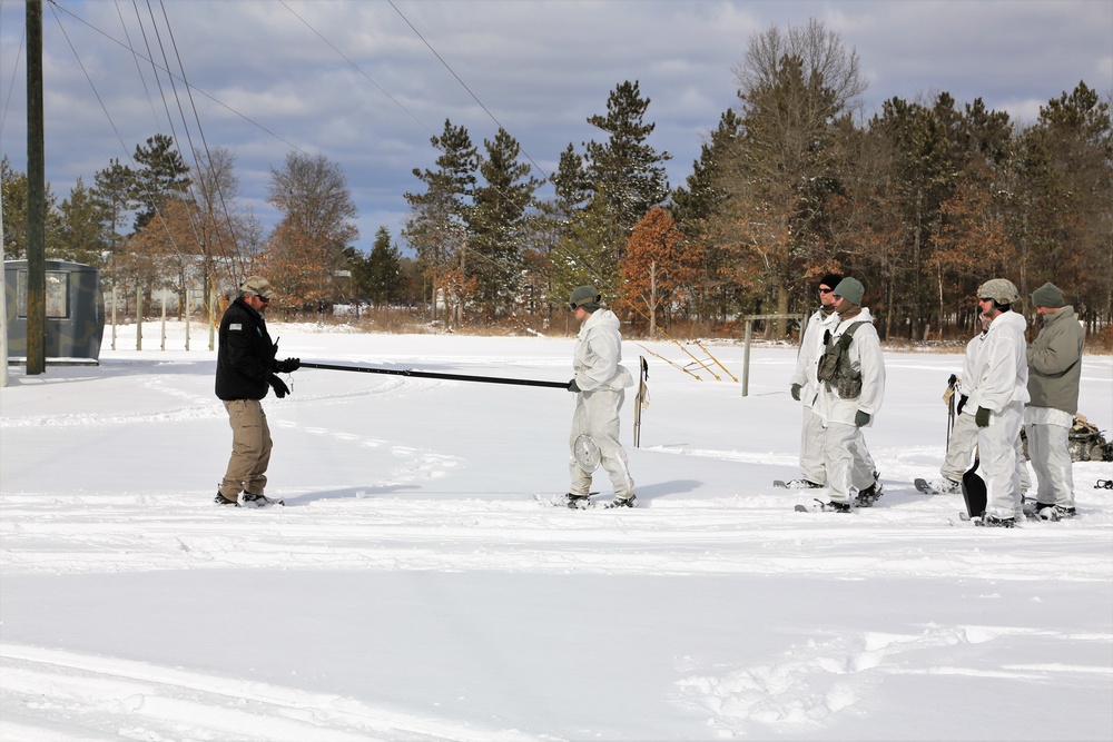 Cold-Weather Operations Course Class 18-06 students build Arctic tents during training at Fort McCoy