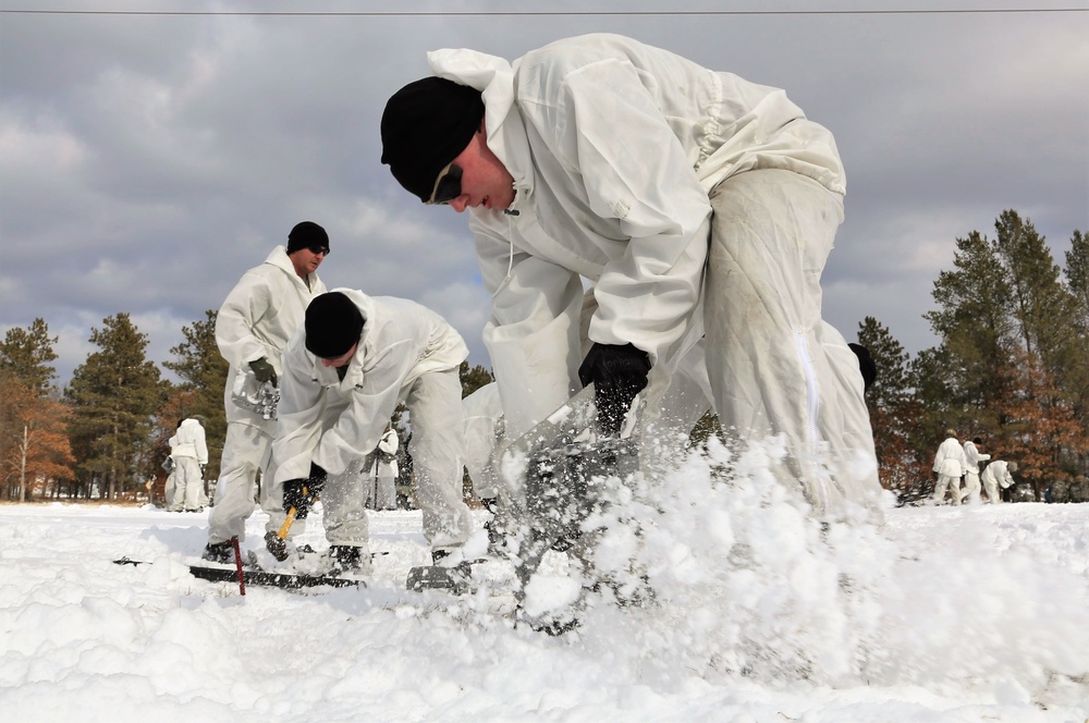 Cold-Weather Operations Course Class 18-06 students build Arctic tents during training at Fort McCoy