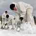 Cold-Weather Operations Course Class 18-06 students build Arctic tents during training at Fort McCoy