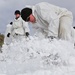 Cold-Weather Operations Course Class 18-06 students build Arctic tents during training at Fort McCoy