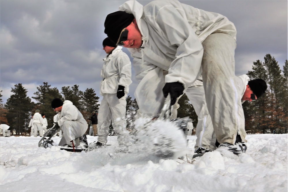 Cold-Weather Operations Course Class 18-06 students build Arctic tents during training at Fort McCoy