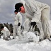 Cold-Weather Operations Course Class 18-06 students build Arctic tents during training at Fort McCoy