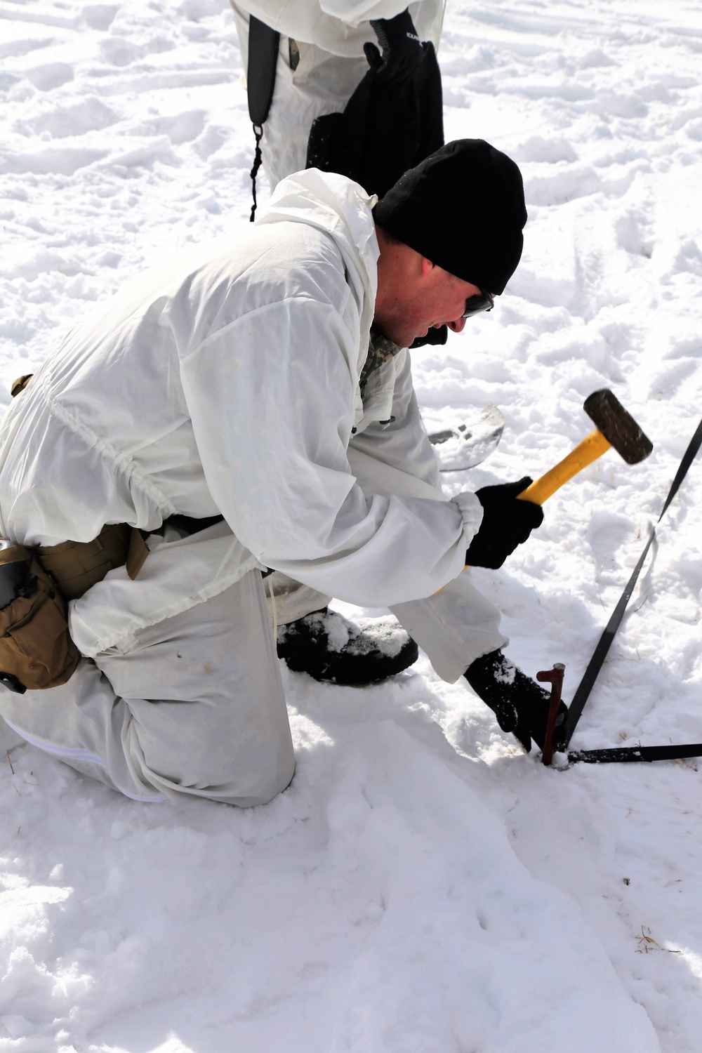 Cold-Weather Operations Course Class 18-06 students build Arctic tents during training at Fort McCoy