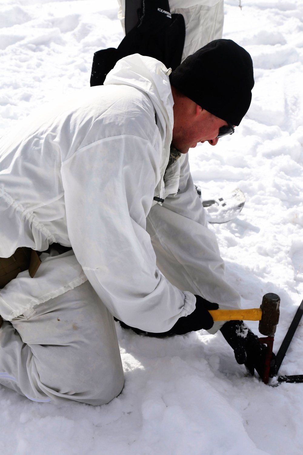 Cold-Weather Operations Course Class 18-06 students build Arctic tents during training at Fort McCoy