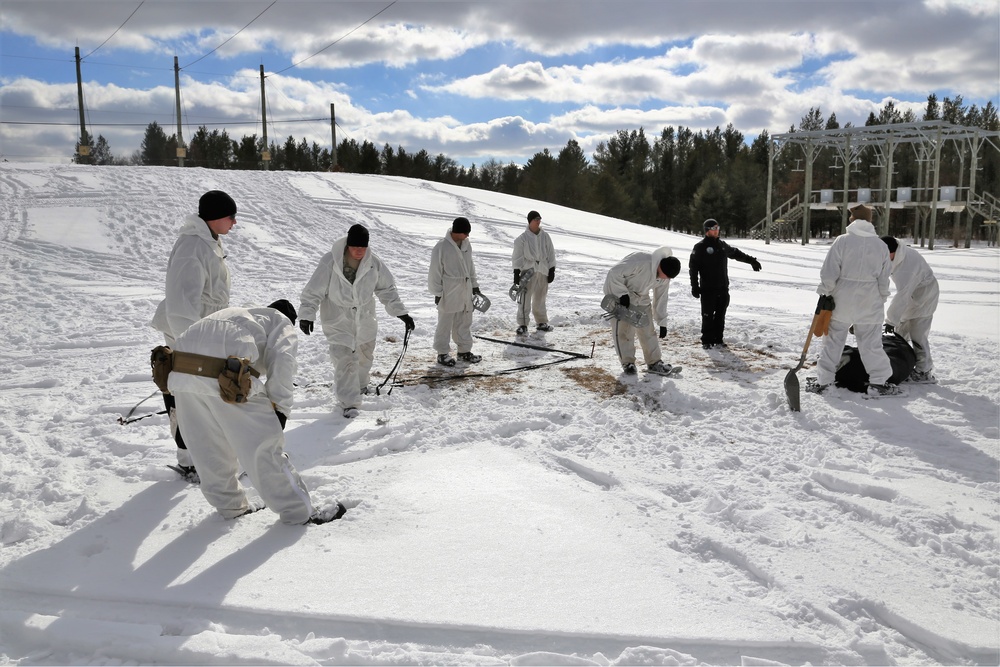 Cold-Weather Operations Course Class 18-06 students build Arctic tents during training at Fort McCoy