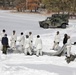 Cold-Weather Operations Course Class 18-06 students build Arctic tents during training at Fort McCoy