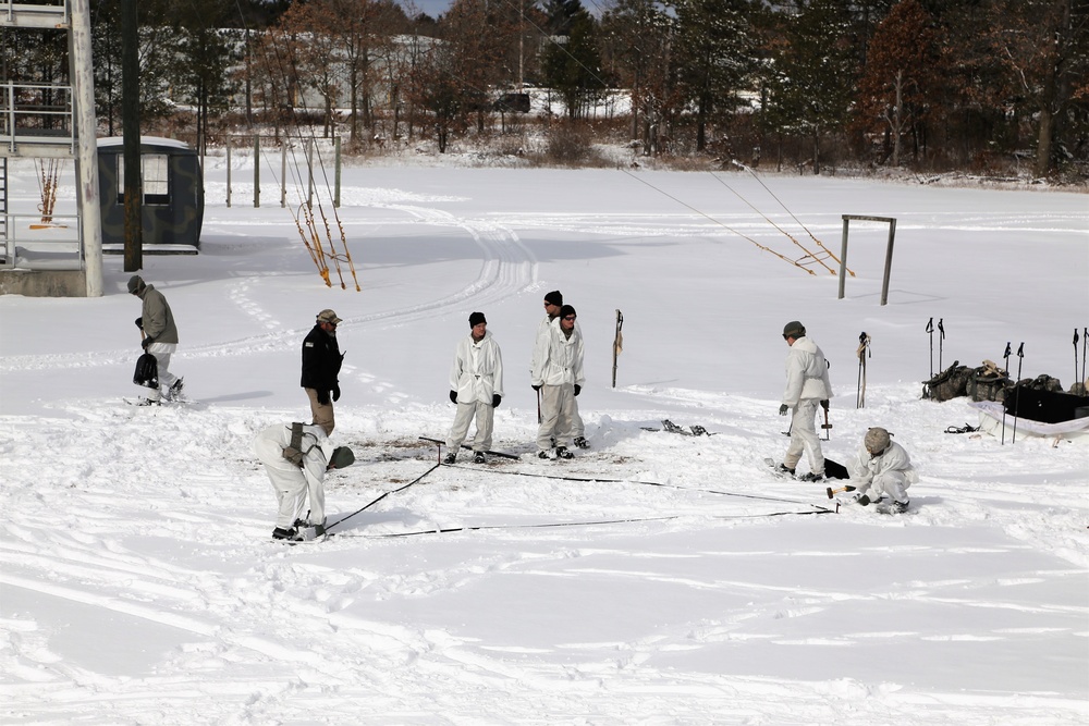 Cold-Weather Operations Course Class 18-06 students build Arctic tents during training at Fort McCoy