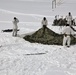 Cold-Weather Operations Course Class 18-06 students build Arctic tents during training at Fort McCoy