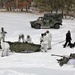 Cold-Weather Operations Course Class 18-04 students build Arctic tents during training at Fort McCoy