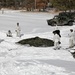 Cold-Weather Operations Course Class 18-04 students build Arctic tents during training at Fort McCoy