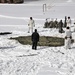 Cold-Weather Operations Course Class 18-04 students build Arctic tents during training at Fort McCoy