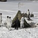 Cold-Weather Operations Course Class 18-04 students build Arctic tents during training at Fort McCoy