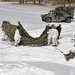 Cold-Weather Operations Course Class 18-06 students build Arctic tents during training at Fort McCoy