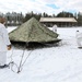 Cold-Weather Operations Course Class 18-06 students build Arctic tents during training at Fort McCoy