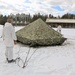 Cold-Weather Operations Course Class 18-06 students build Arctic tents during training at Fort McCoy