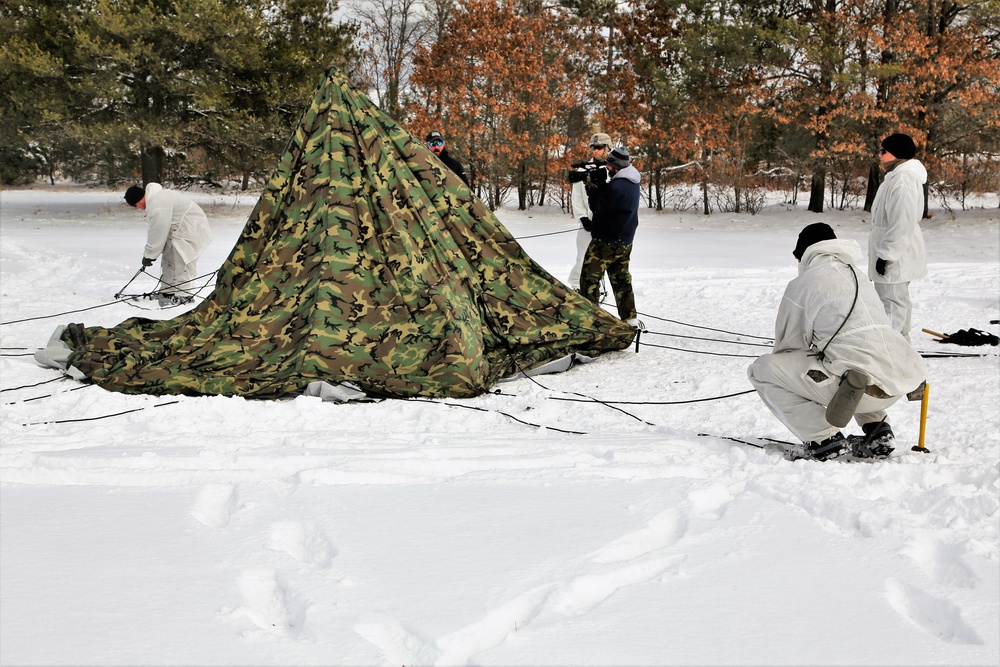 Cold-Weather Operations Course Class 18-06 students build Arctic tents during training at Fort McCoy