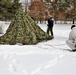 Cold-Weather Operations Course Class 18-06 students build Arctic tents during training at Fort McCoy