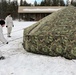 Cold-Weather Operations Course Class 18-06 students build Arctic tents during training at Fort McCoy