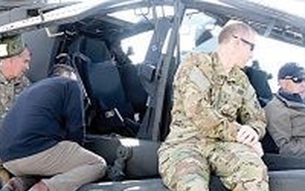 Business executives observe training, equipment