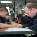 USS Bonhomme Richard (LHD 6) Sailors take the Navywide E-4 Advancement Exam