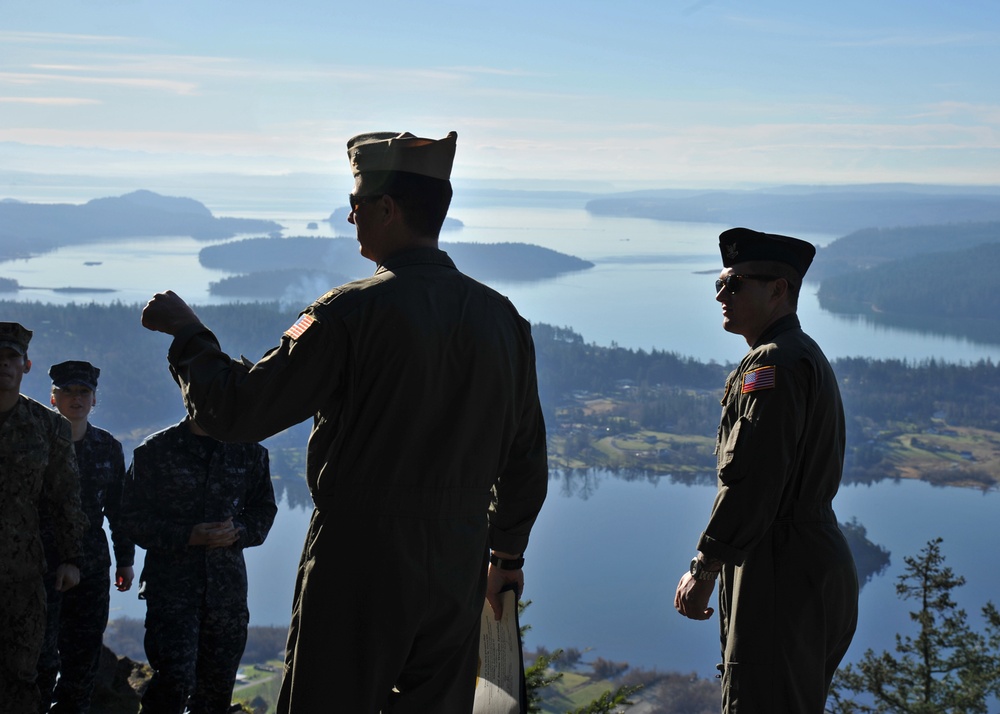 Lt. Cmdr. Justin Jennings reenlists AWO2 Fouche on Mt. Erie