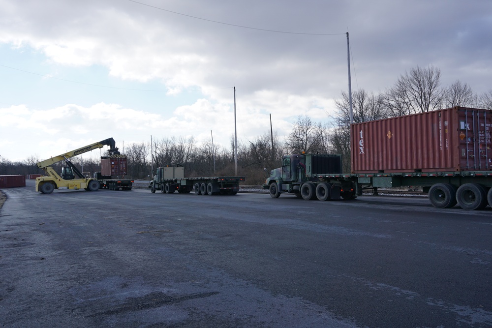 A Letterkenny Munitions Center employees unload shipping containers from the 1048th Transportation Company, Connecticut Army National Guard’s flatbed trailers in support of Operation Patriot Bandoleer.