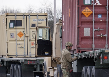 A 432nd Transportation Company, U.S. Army Reserve - Puerto Rico Soldier prepares for Letterkenny Munitions Center to unload the shipping container from his flatbed in support of Operation Patriot Bandoleer.