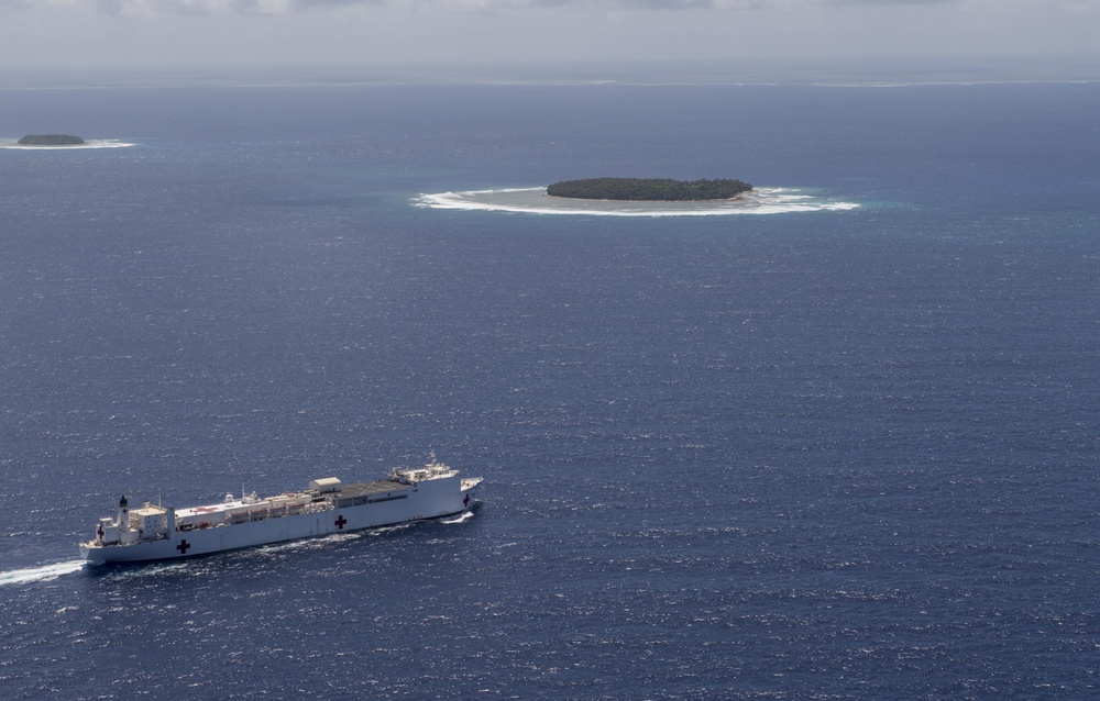 USNS Mercy Transits water near the Ulithi Atoll