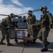 Sailors aboard USNS Mercy transfer medical supplies to Ulithi