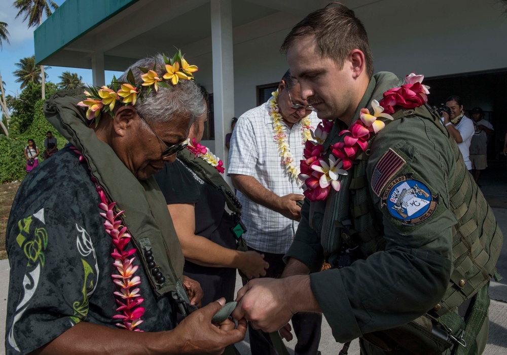 Sailors aboard USNS Mercy transfer medical supplies to Ulithi