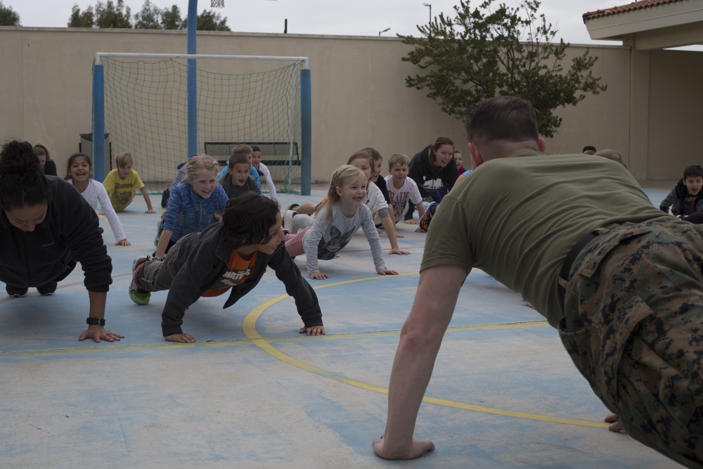 U.S. Marines with SPMAGTF-CR-AF LCE 18.2 help Sigonella Elementary School children ‘overcome obstacles’