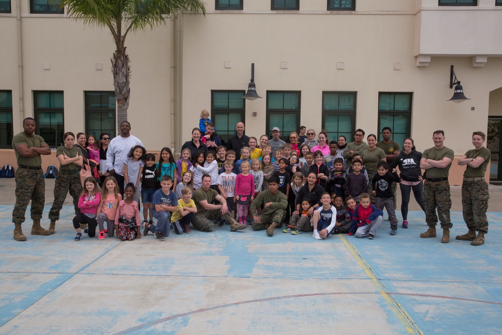 U.S. Marines with SPMAGTF-CR-AF LCE 18.2 help Sigonella Elementary School children ‘overcome obstacles’