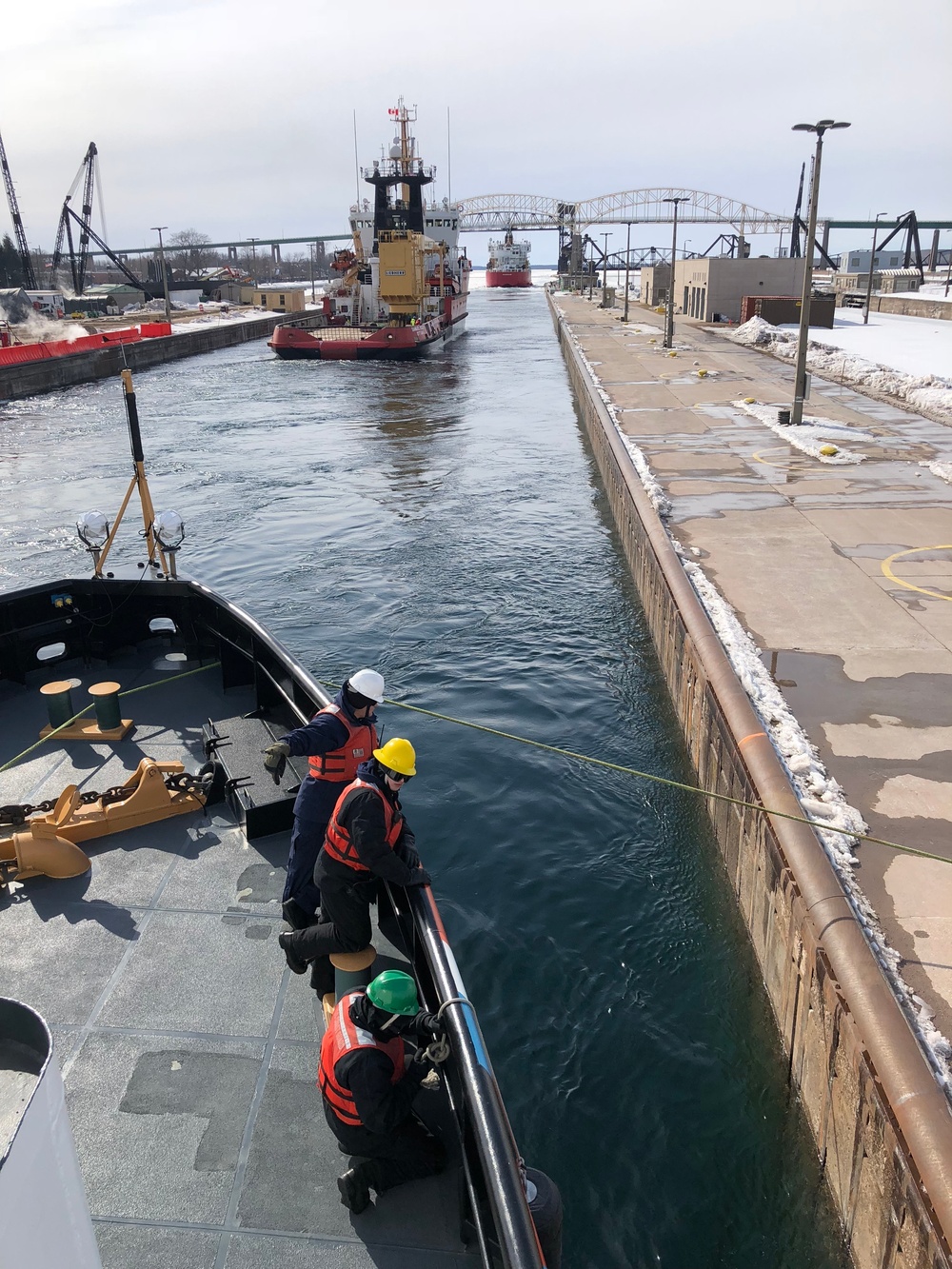 U.S. and Canadian Coast Guards exit the Soo Locks