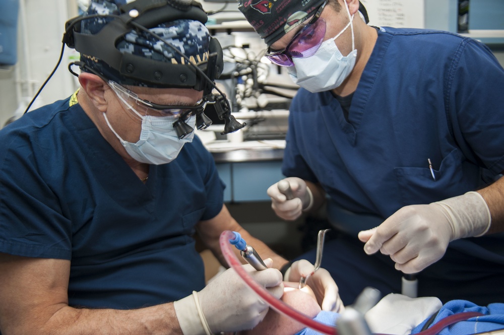 GHWB Dental Officer Performs Oral Surgery