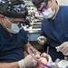 GHWB Dental Officer Performs Oral Surgery