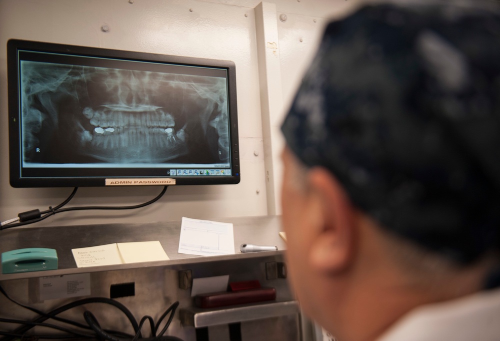 GHWB Dental Officer Performs Oral Surgery
