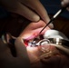 GHWB Dental Officer Performs Oral Surgery