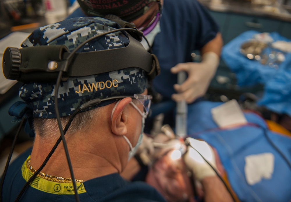 GHWB Dental Officer Performs Oral Surgery